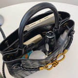 Metal rope buckle woven shoulder bag, fashionable, versatile, retro, commuter bag for women.
