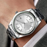 Montre homme CHRONOS à quartz, étanche, avec date et affichage lumineux, en acier inoxydable, style décontracté et sportif.